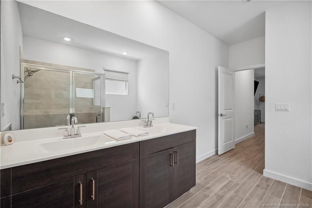 Bathroom, Dual Sink Vanities, Glass Shower, Interior, Recessed Lighting, Wood Texture Flooring