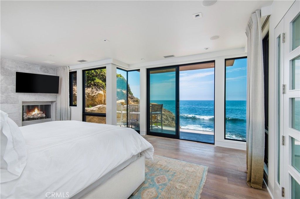 Bedroom, Fireplace, Interior, Recessed Lighting, Water, Wood Texture Flooring