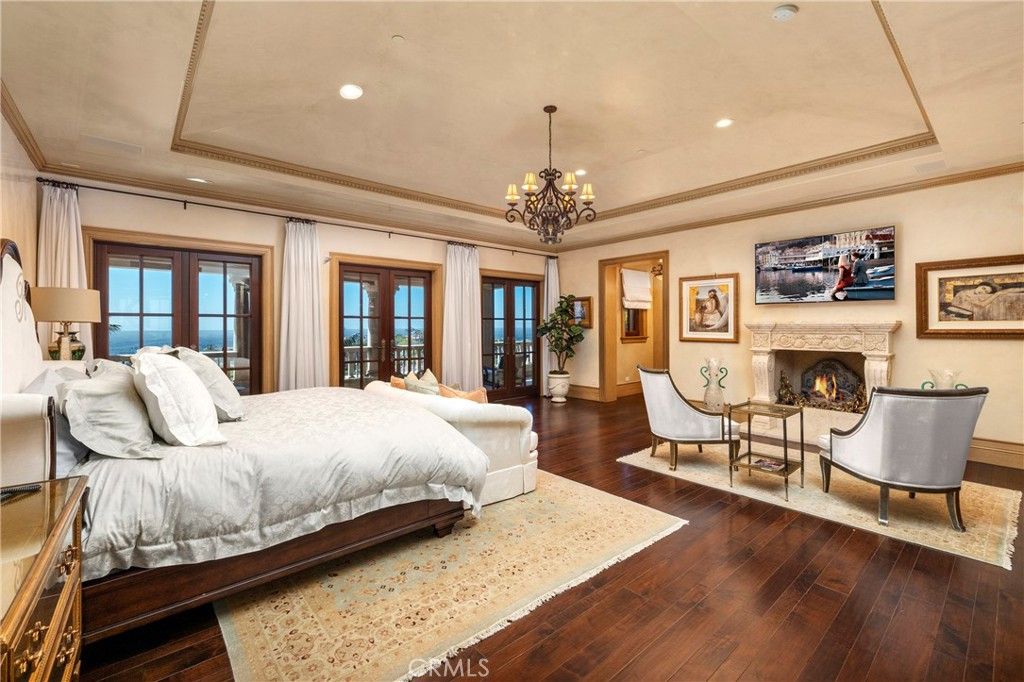 Bedroom, Chandelier, Fireplace, Interior, Recessed Lighting, Water, Wood Texture Flooring
