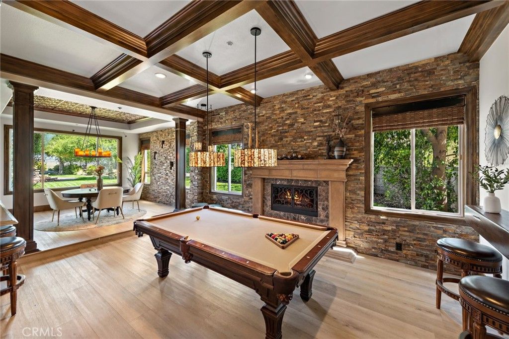 Billiard Table, Chandelier, Dining room, Fireplace, Game Room, Interior, Pendant Lights, Recessed Lighting, Stone Walls, Wooden Beams, Wood Texture Flooring