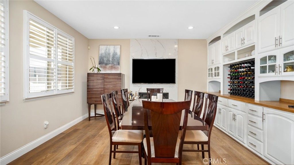 Dining room, Interior, Marble Walls, Recessed Lighting, Wine Storage, Wood Texture Flooring