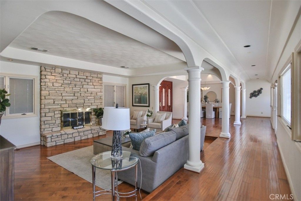 Fireplace, Interior, Living room, Recessed Lighting, Stone Walls, Wood Texture Flooring