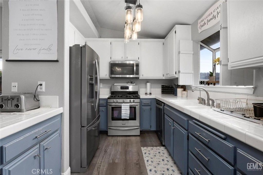 Interior, Kitchen, Stainless Steel Appliances, Tile Countertops, Wood Texture Flooring