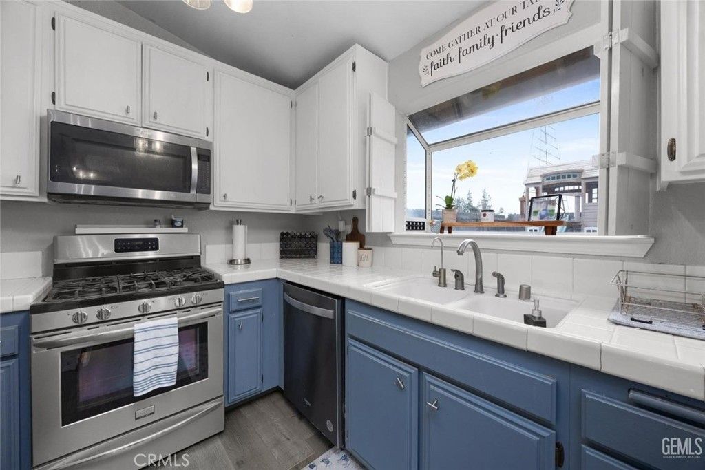 Interior, Kitchen, Stainless Steel Appliances, Tile Countertops, Wood Texture Flooring