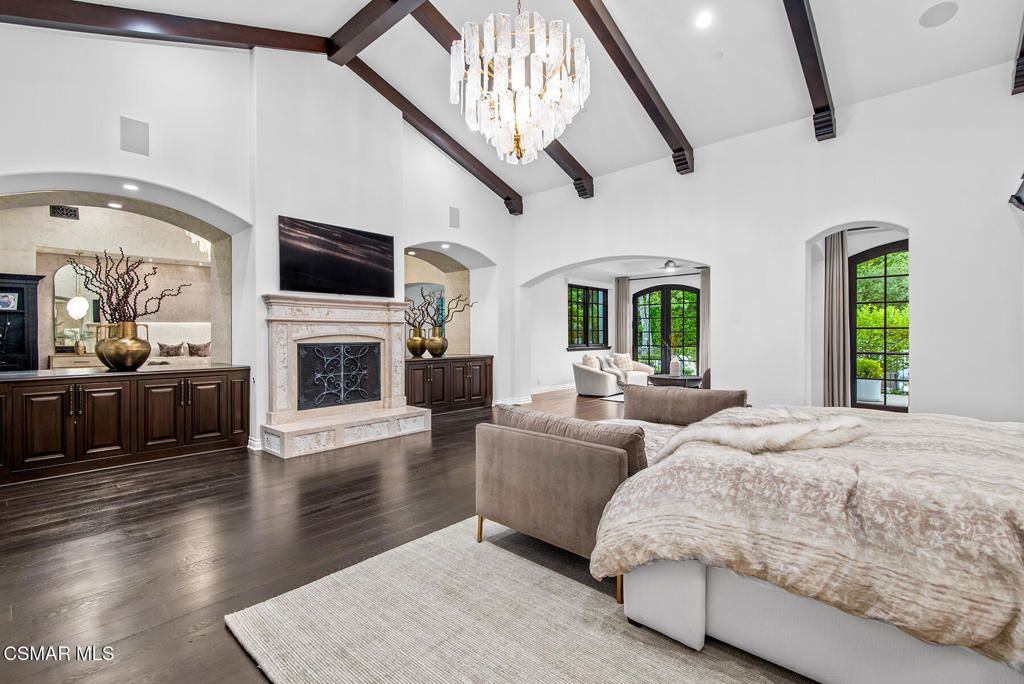 Bedroom, Chandelier, Fireplace, Interior, Recessed Lighting, Wooden Beams, Wood Texture Flooring