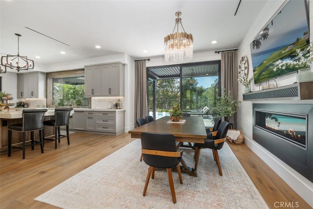 Chandelier, Dining room, Fireplace, Interior, Pendant Lights, Recessed Lighting, Wood Texture Flooring