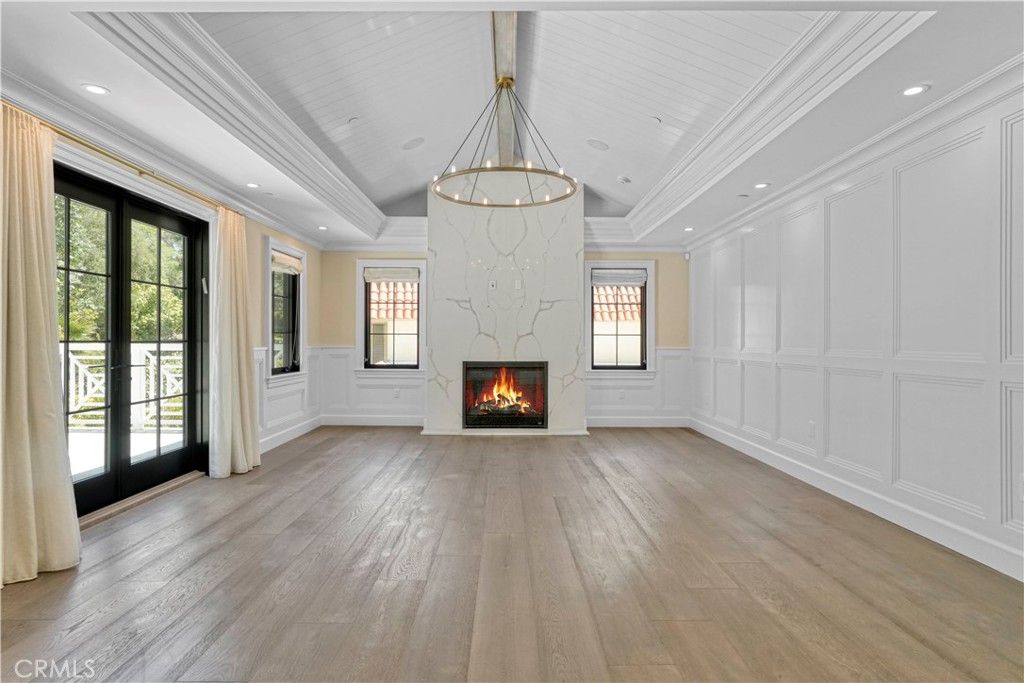 Chandelier, Empty room, Fireplace, Interior, Pendant Lights, Recessed Lighting, Wood Texture Flooring