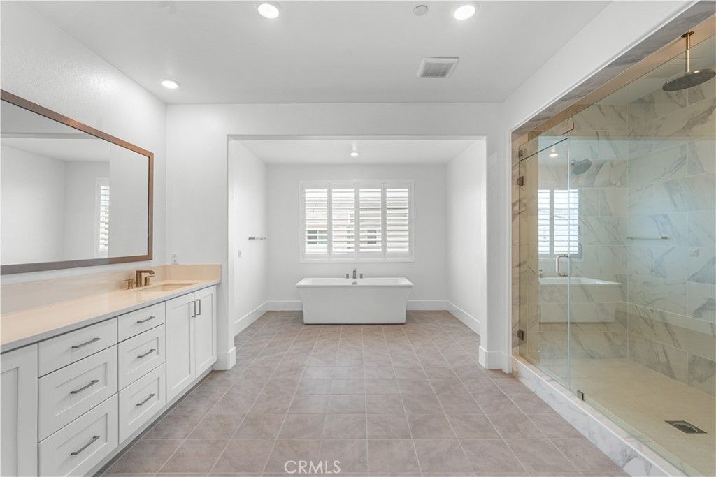 Bathroom, Dual Sink Vanities, Free Standing Baths, Glass Shower, Interior, Marble Walls, Recessed Lighting