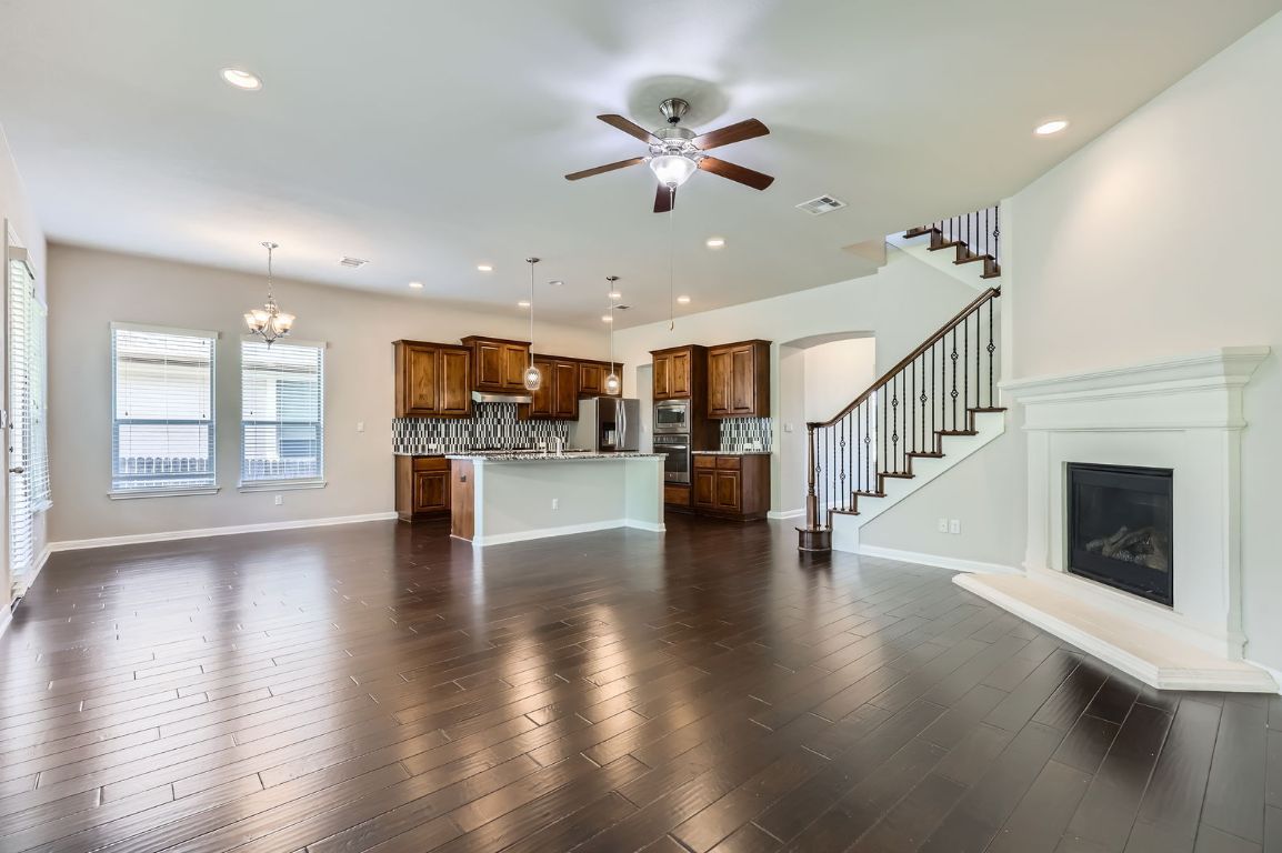 Chandelier, Fireplace, Interior, Kitchen, Pendant Lights, Recessed Lighting, Wood Texture Flooring