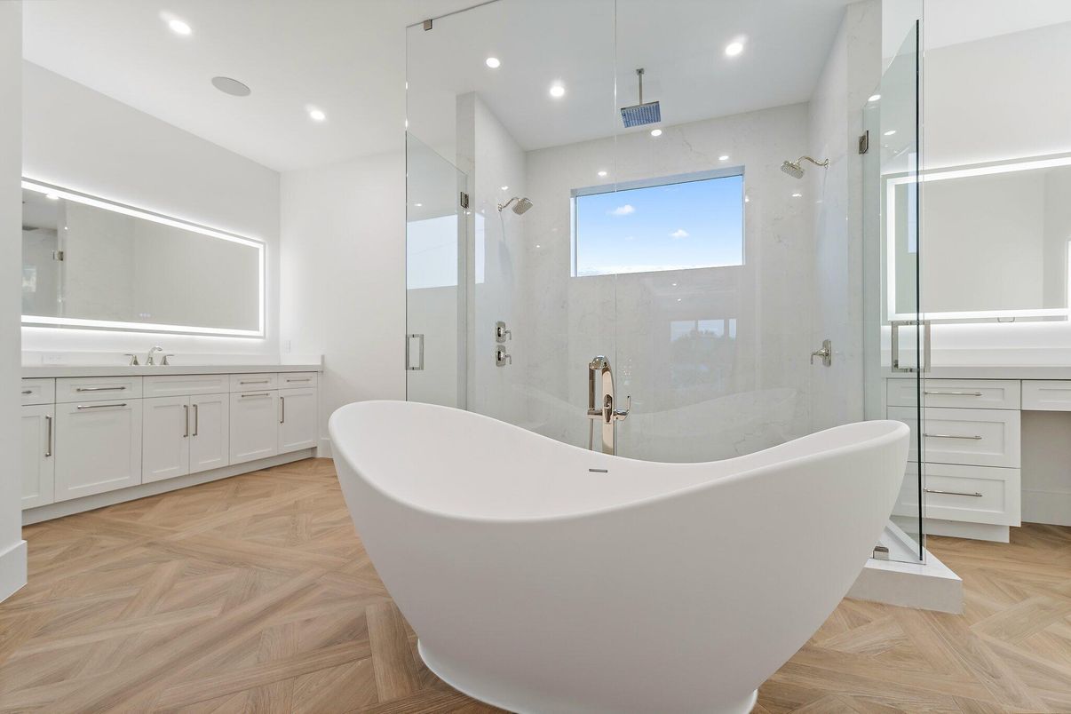 Bathroom, Free Standing Baths, Glass Shower, Interior, Marble Walls, Recessed Lighting, Wood Texture Flooring