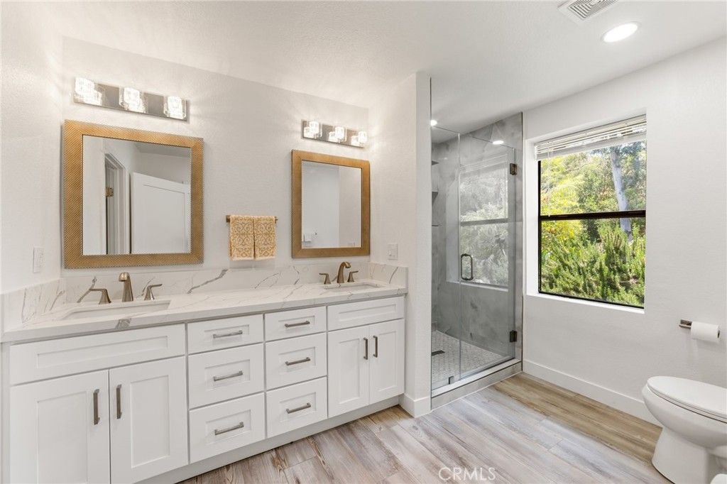 Bathroom, Dual Sink Vanities, Glass Shower, Interior, Recessed Lighting, Wood Texture Flooring