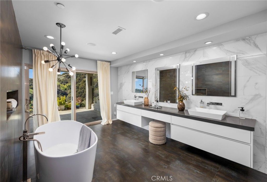 Bathroom, Dual Sink Vanities, Free Standing Baths, Interior, Marble Walls, Pendant Lights, Recessed Lighting, Wood Texture Flooring