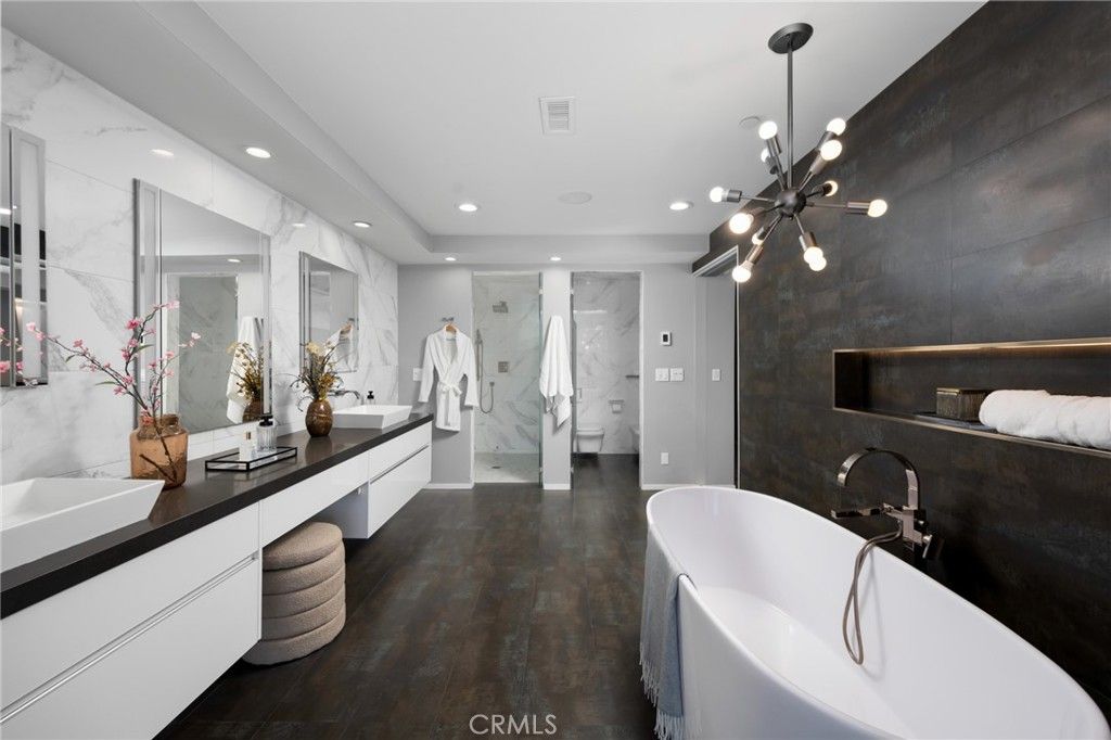 Bathroom, Dual Sink Vanities, Free Standing Baths, Glass Shower, Interior, Marble Walls, Pendant Lights, Recessed Lighting, Wood Texture Flooring