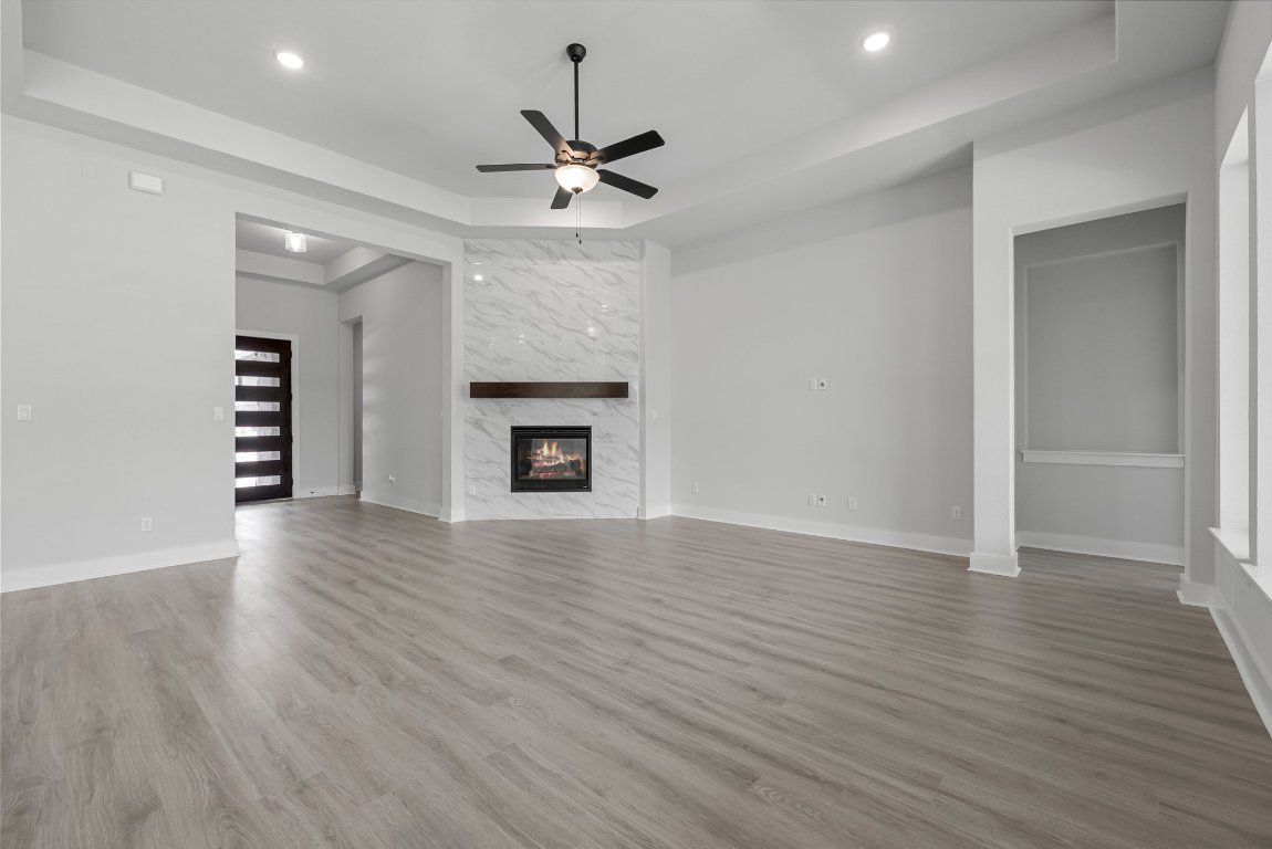 Empty room, Fireplace, Interior, Marble Walls, Recessed Lighting, Wood Texture Flooring