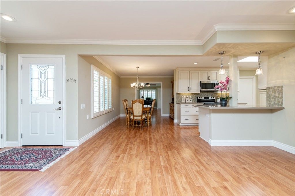 Chandelier, Dining room, Interior, Kitchen, Pendant Lights, Recessed Lighting, Stainless Steel Appliances, Wood Texture Flooring