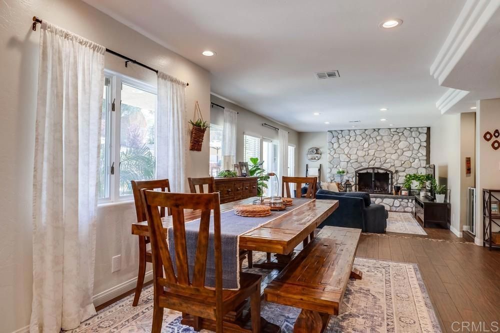 Dining room, Fireplace, Interior, Recessed Lighting, Stone Walls, Wood Texture Flooring