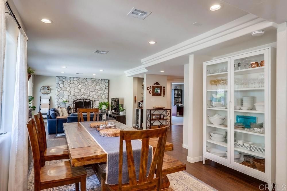 Dining room, Fireplace, Interior, Recessed Lighting, Stone Walls, Wood Texture Flooring