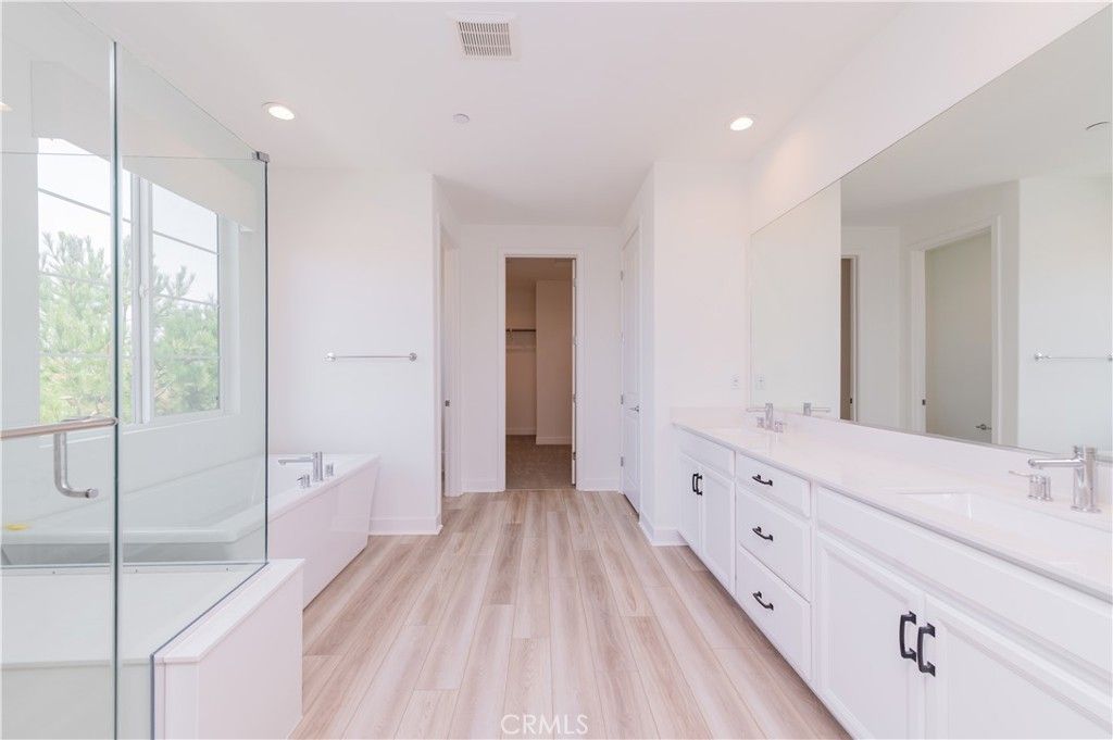 Bathroom, Dual Sink Vanities, Glass Shower, Interior, Recessed Lighting, Wood Texture Flooring