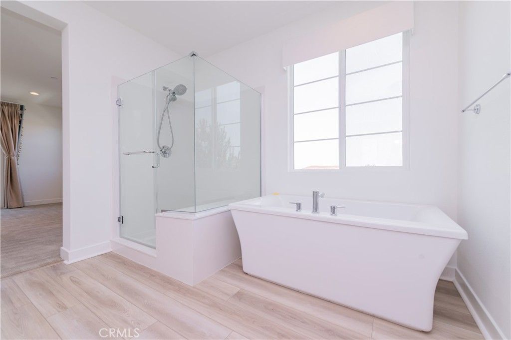 Bathroom, Free Standing Baths, Glass Shower, Interior, Recessed Lighting, Wood Texture Flooring