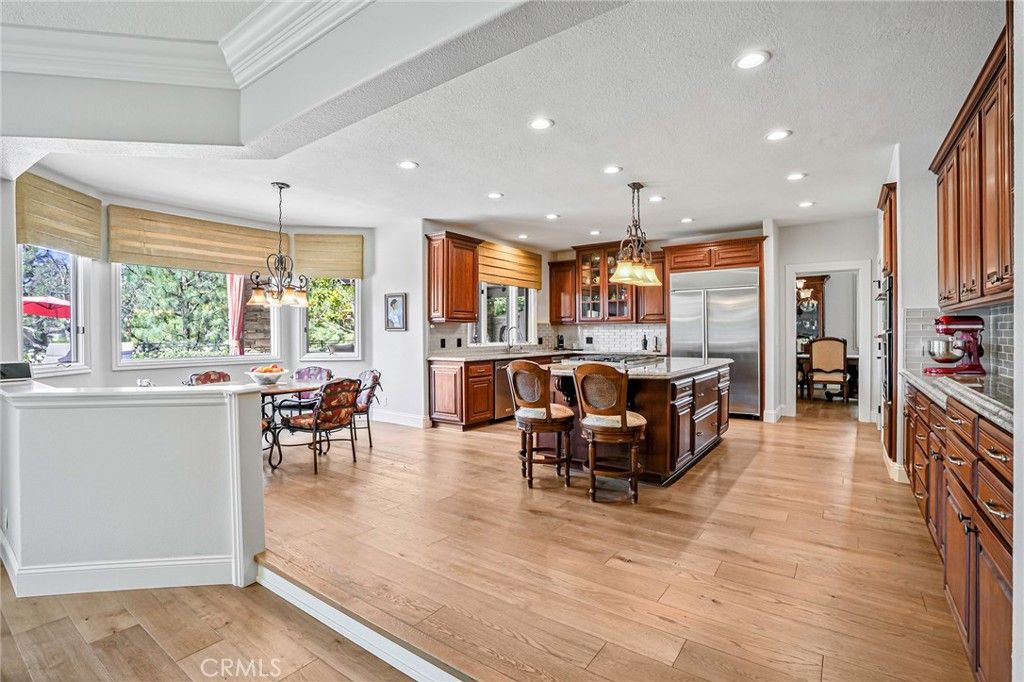 Chandelier, Dining room, Interior, Kitchen, Pendant Lights, Recessed Lighting, Stainless Steel Appliances, Wood Texture Flooring