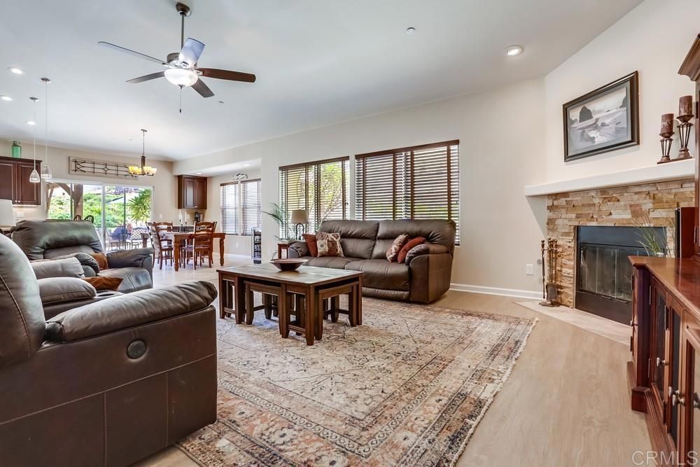 Chandelier, Dining room, Fireplace, Interior, Living room, Pendant Lights, Recessed Lighting, Wood Texture Flooring