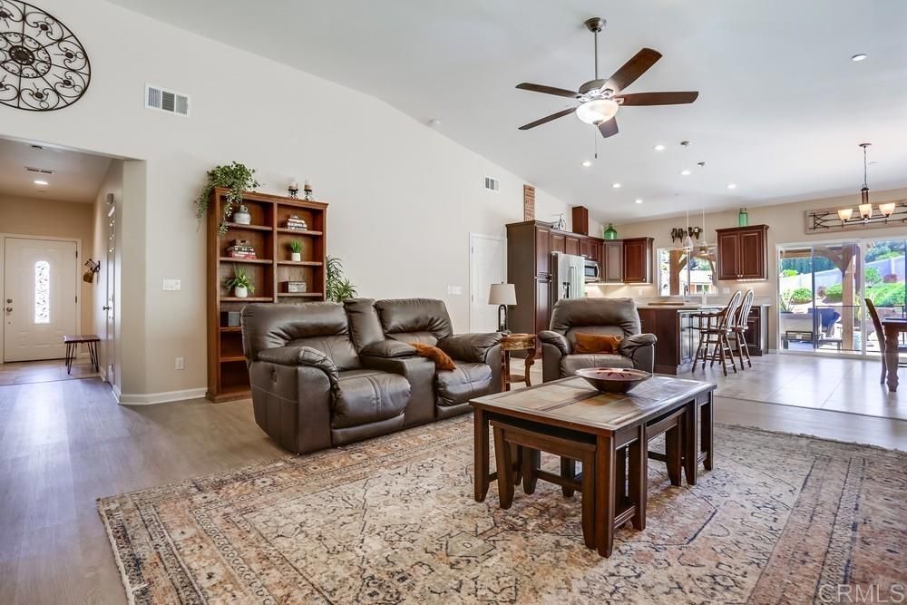 Chandelier, Dining room, Interior, Kitchen, Living room, Pendant Lights, Recessed Lighting, Stainless Steel Appliances, Wood Texture Flooring
