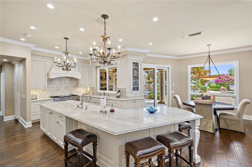 Chandelier, Dining room, Interior, Kitchen, Pendant Lights, Recessed Lighting, Stainless Steel Appliances, Wood Texture Flooring