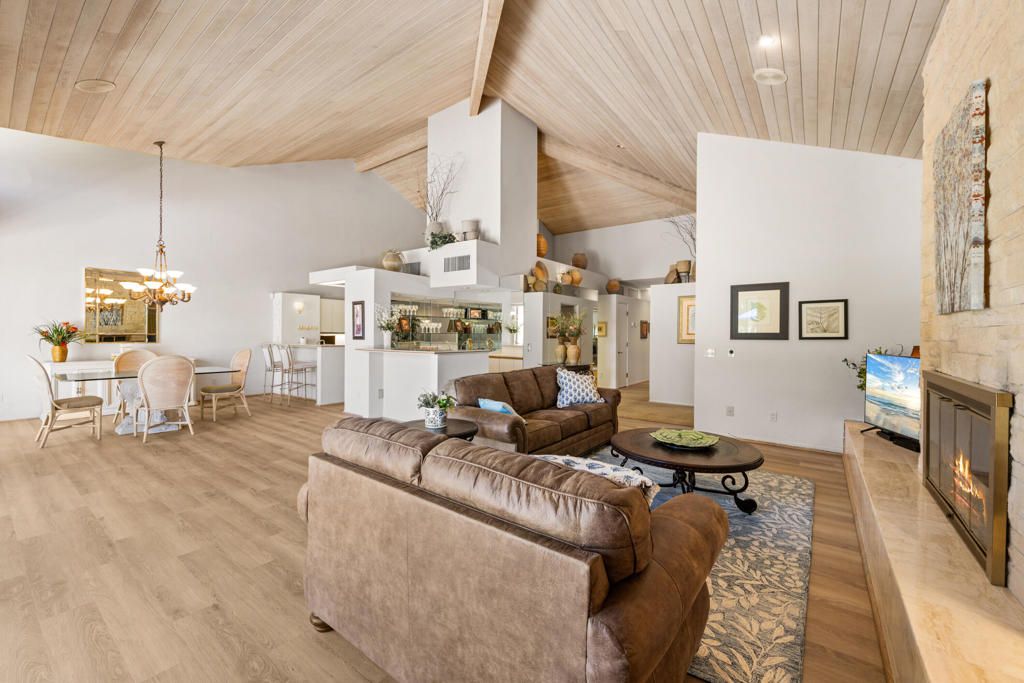 Chandelier, Dining room, Fireplace, Interior, Living room, Pendant Lights, Recessed Lighting, Wooden Ceilings, Wood Texture Flooring
