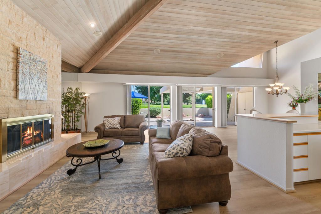 Chandelier, Fireplace, Interior, Living room, Pendant Lights, Recessed Lighting, Stone Walls, Wooden Beams, Wooden Ceilings, Wood Texture Flooring