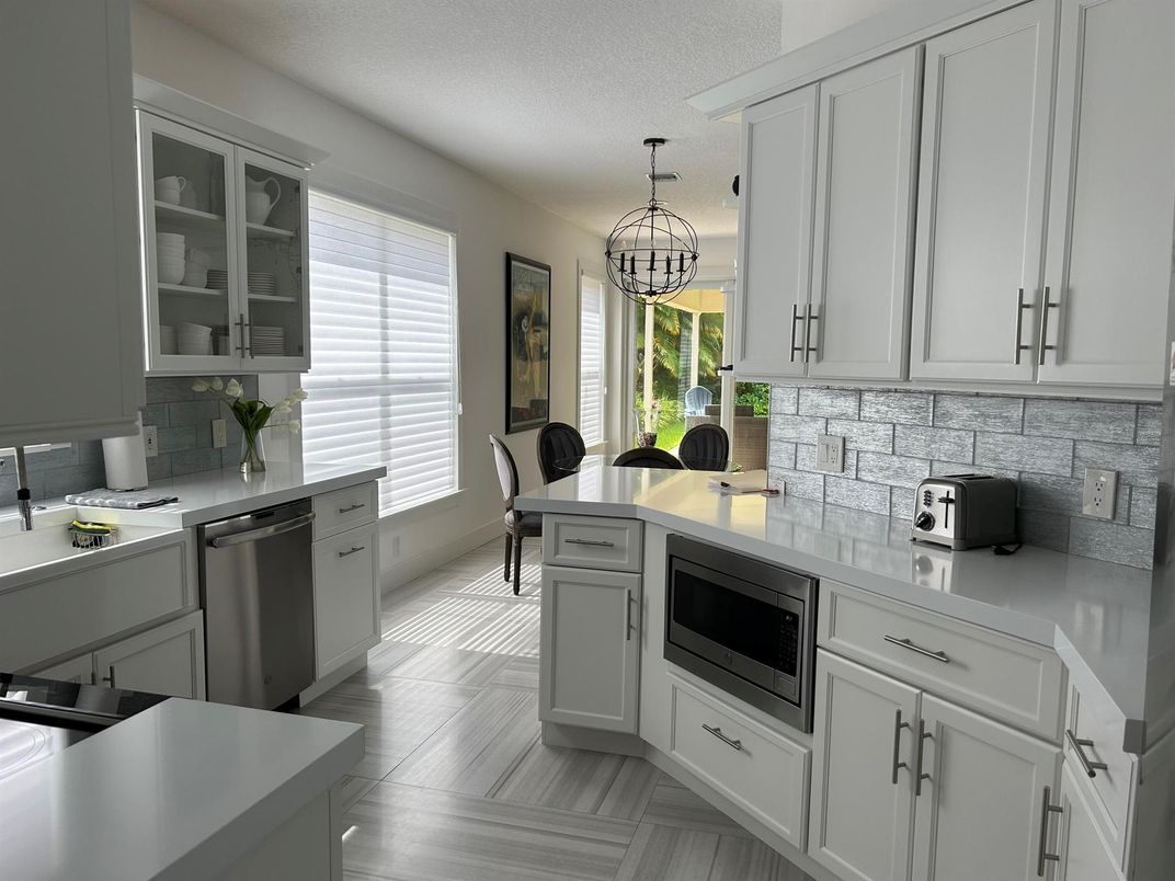 Chandelier, Dining room, Interior, Kitchen, Pendant Lights, Stainless Steel Appliances, Wood Texture Flooring