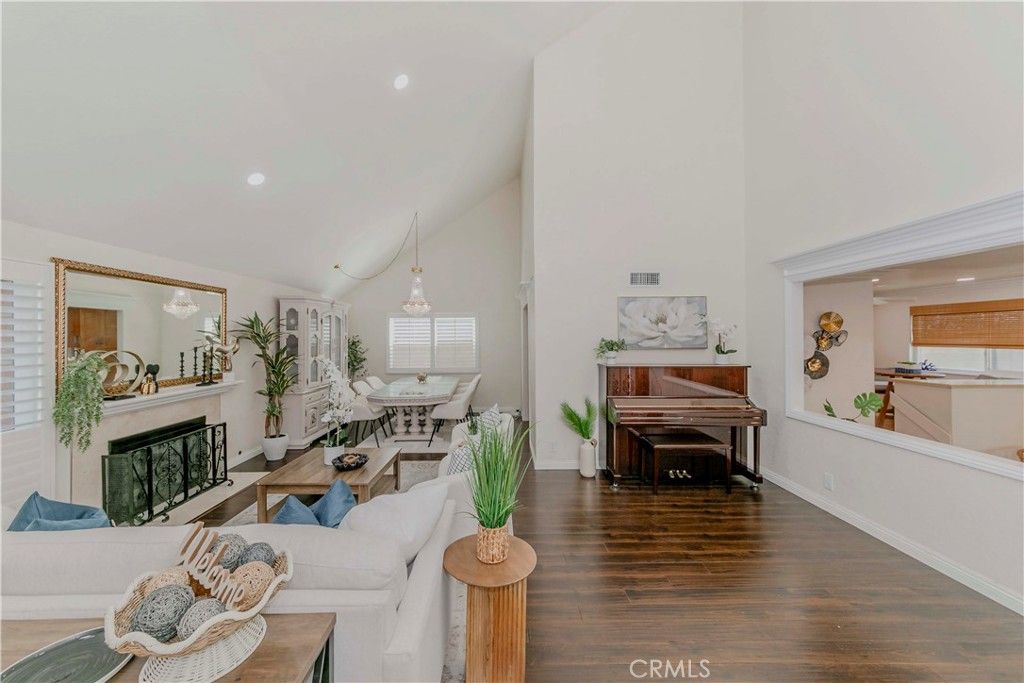 Dining room, Fireplace, Interior, Living room, Piano, Recessed Lighting, Wood Texture Flooring