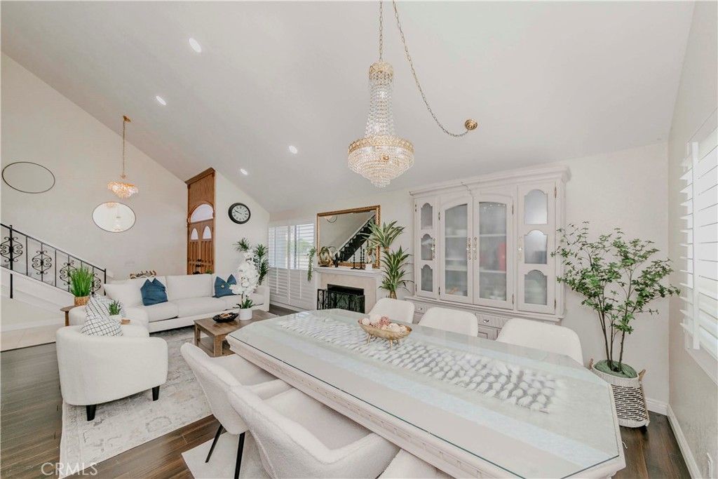 Chandelier, Dining room, Fireplace, Interior, Living room, Pendant Lights, Recessed Lighting, Wood Texture Flooring