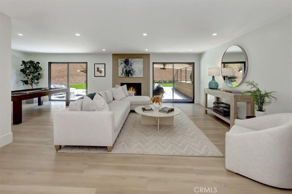 Billiard Table, Fireplace, Game Room, Interior, Living room, Recessed Lighting, Wood Texture Flooring