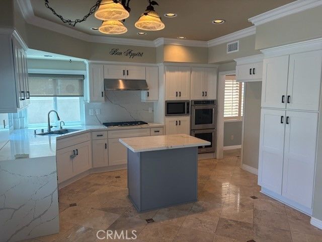 Interior, Kitchen, Marble Walls, Recessed Lighting, Stainless Steel Appliances