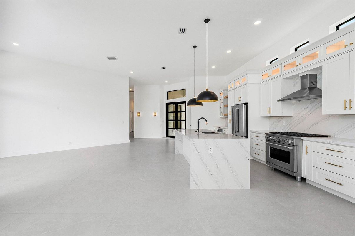 Interior, Kitchen, Marble Walls, Pendant Lights, Recessed Lighting, Stainless Steel Appliances