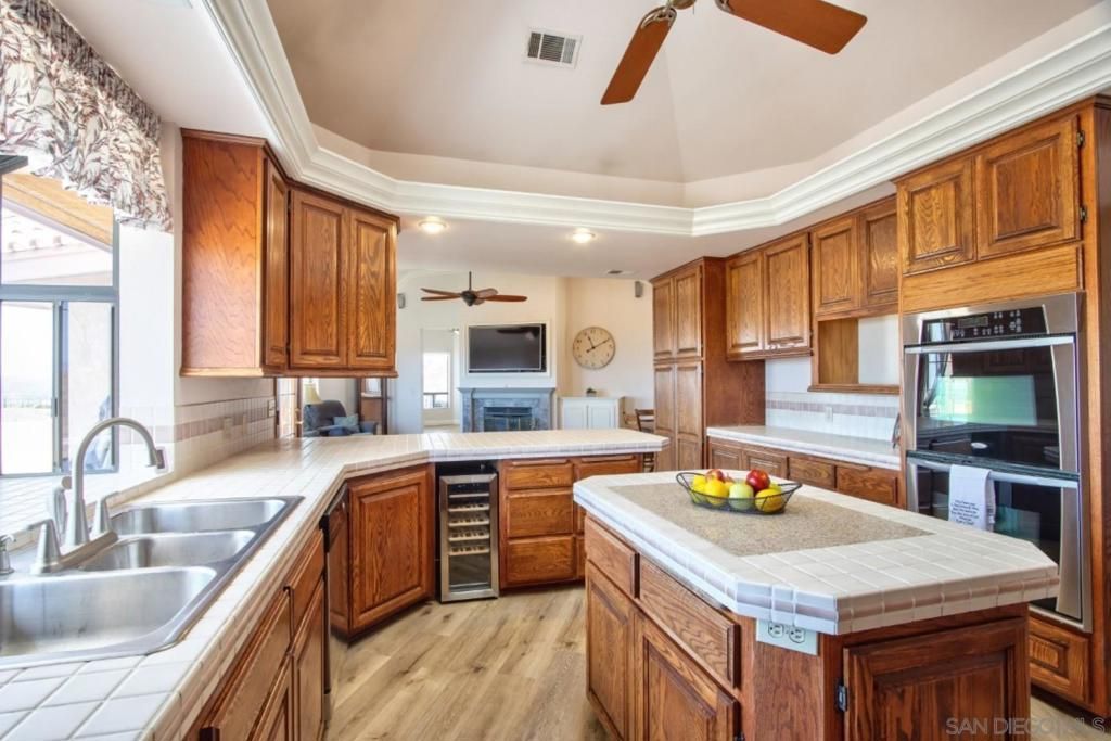 Interior, Kitchen, Recessed Lighting, Tile Countertops, Wood Texture Flooring