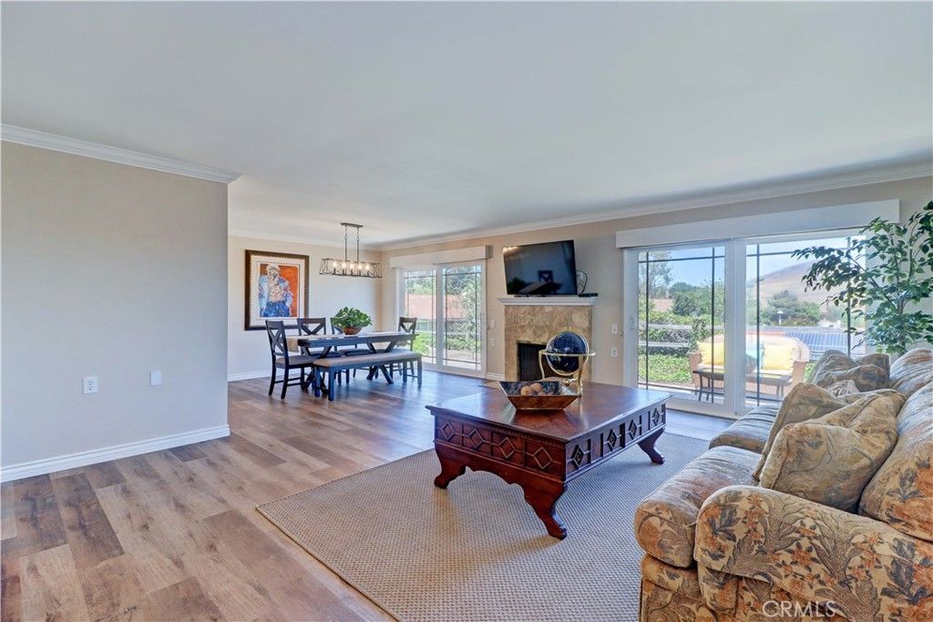 Chandelier, Dining room, Fireplace, Interior, Living room, Pendant Lights, Wood Texture Flooring