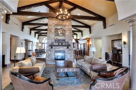 Chandelier, Fireplace, Interior, Living room, Recessed Lighting, Stone Walls, Wooden Beams