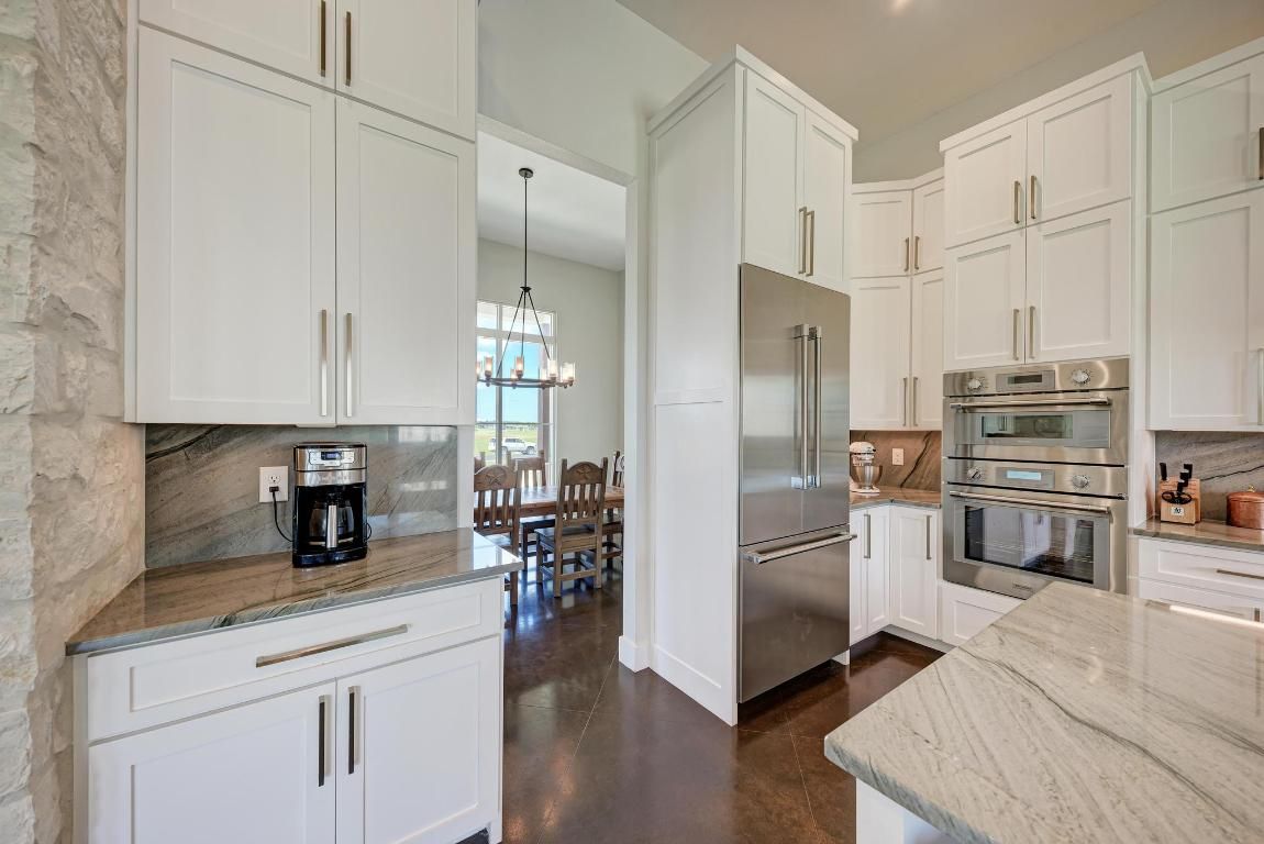 Chandelier, Dining room, Interior, Kitchen, Pendant Lights, Recessed Lighting, Stainless Steel Appliances, Wood Texture Flooring