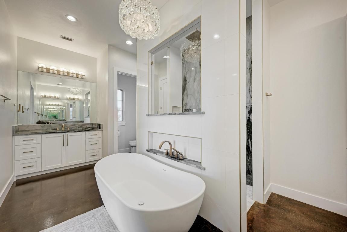 Bathroom, Chandelier, Dual Sink Vanities, Free Standing Baths, Interior, Recessed Lighting