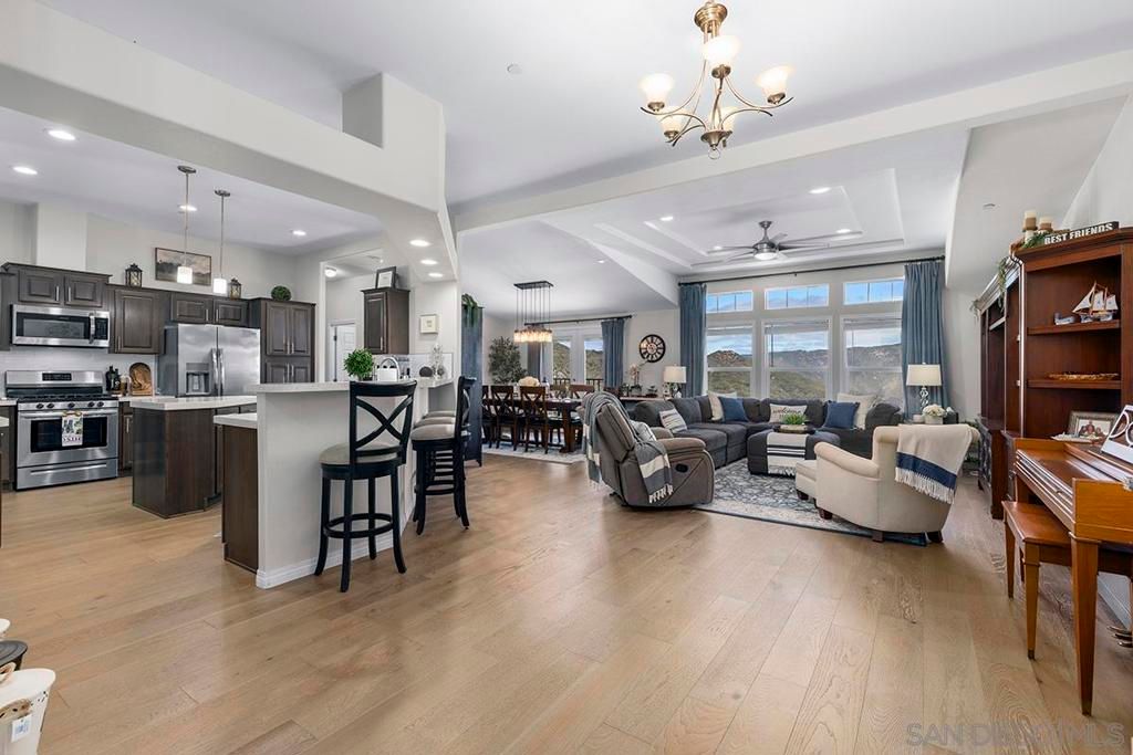 Chandelier, Dining room, Interior, Kitchen, Living room, Pendant Lights, Recessed Lighting, Stainless Steel Appliances, Wood Texture Flooring