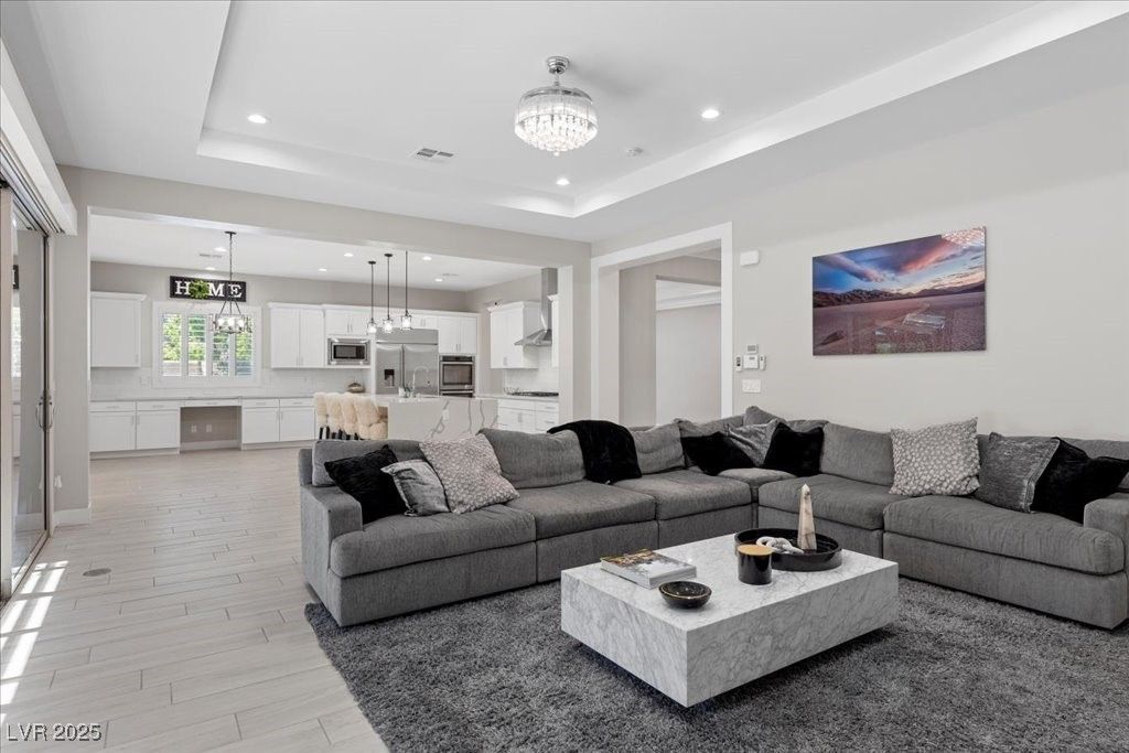 Chandelier, Interior, Kitchen, Living room, Pendant Lights, Recessed Lighting, Stainless Steel Appliances, Wood Texture Flooring