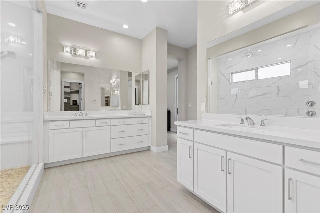 Bathroom, Dual Sink Vanities, Interior, Marble Walls, Recessed Lighting, Wood Texture Flooring