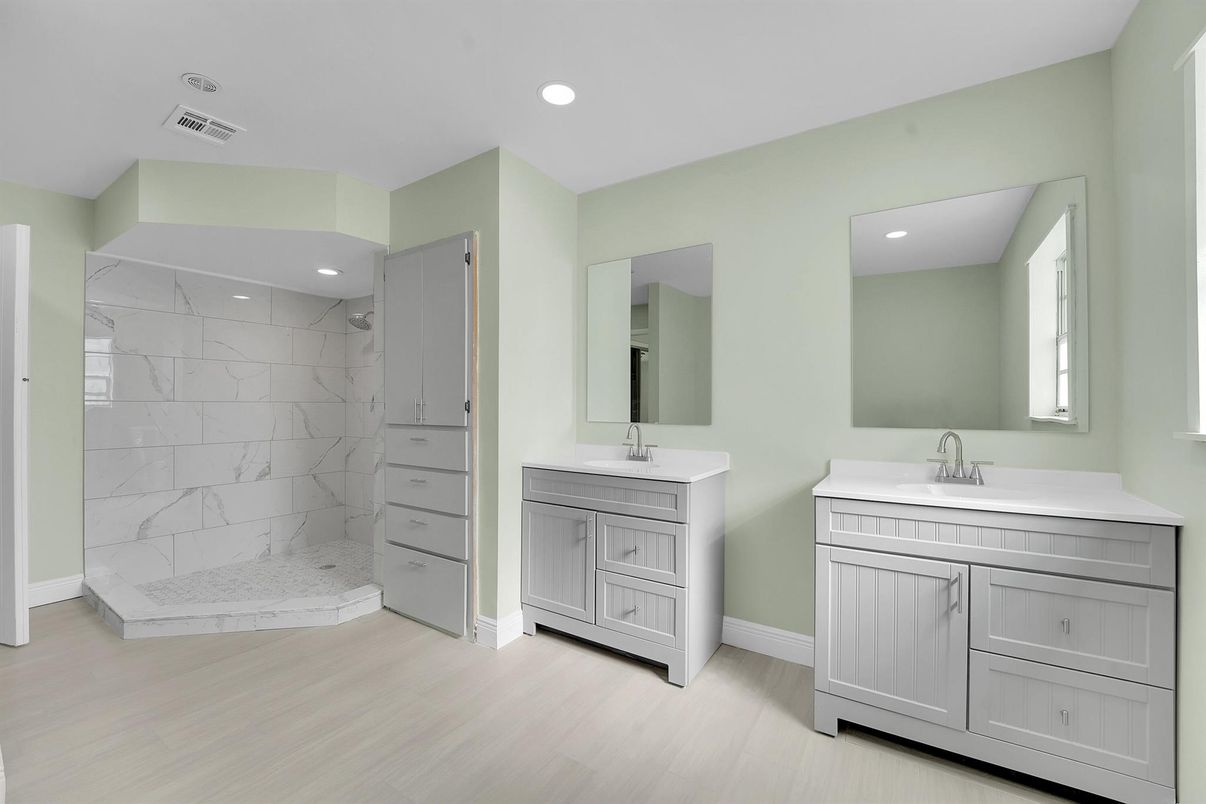 Bathroom, Dual Sink Vanities, Interior, Marble, Marble Walls, Recessed Lighting, Wood Texture Flooring