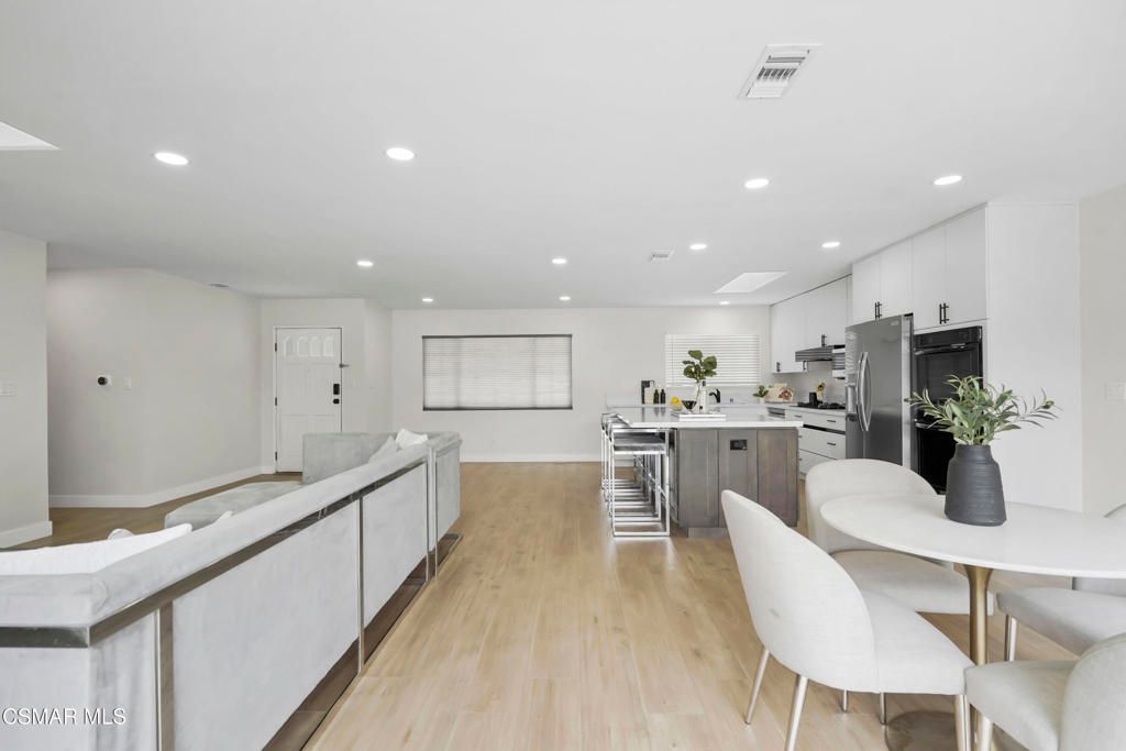 Dining room, Interior, Kitchen, Recessed Lighting, Stainless Steel Appliances, Wood Texture Flooring