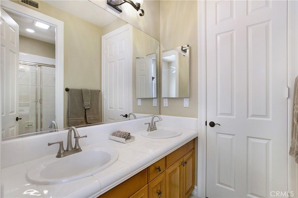 Bathroom, Dual Sink Vanities, Glass Shower, Interior, Recessed Lighting, Tile Countertops