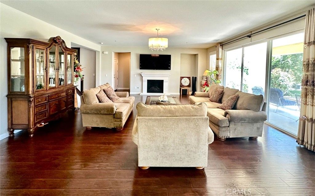 Chandelier, Fireplace, Interior, Living room, Recessed Lighting, Wood Texture Flooring