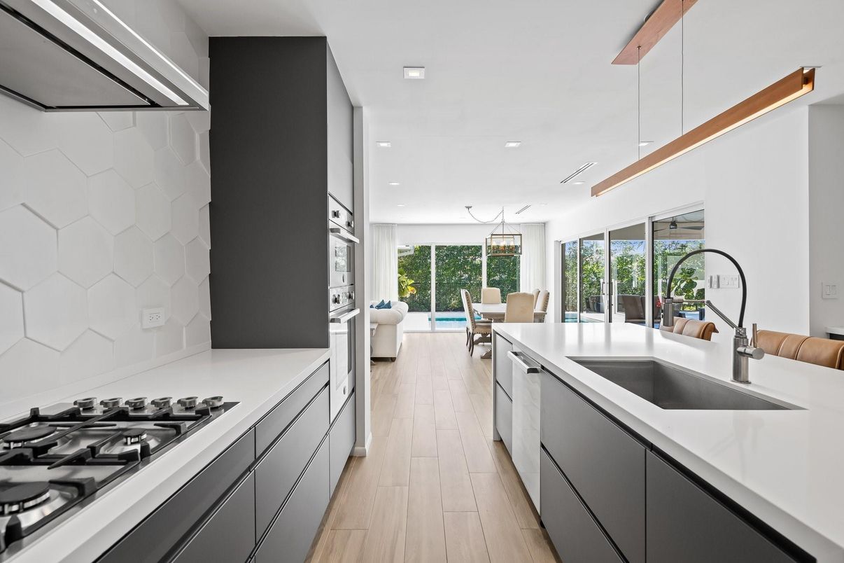 Dining room, Interior, Kitchen, Pendant Lights, Recessed Lighting, Stainless Steel Appliances, Wood Texture Flooring