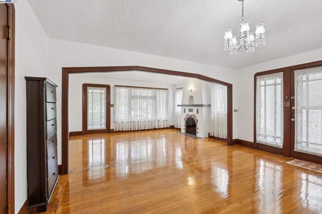 Chandelier, Empty room, Fireplace, Interior, Wood Texture Flooring