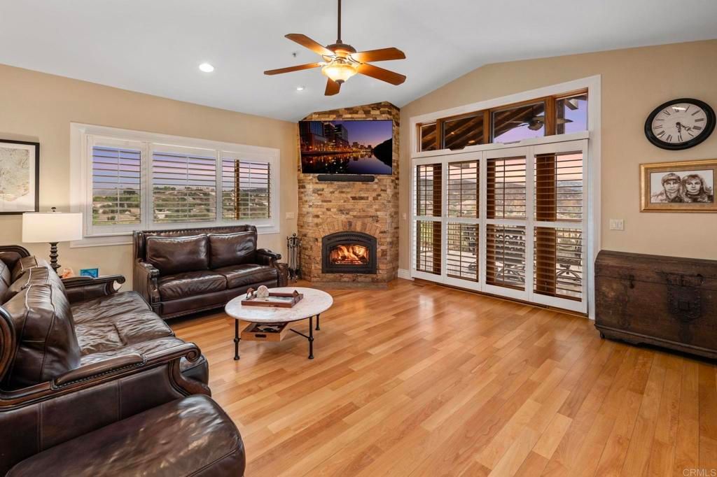 Fireplace, Interior, Living room, Recessed Lighting, Stone Walls, Wood Texture Flooring